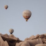 Hot Air Balloons over Hills (Photo by Mesut çiçen)