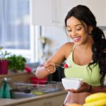 Woman eating vegetables Photo by Nathan Cowley: https://www.pexels.com/photo/smiling-woman-eating-healthy-1153367/