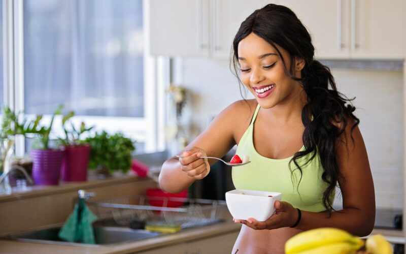 Woman eating vegetables Photo by Nathan Cowley: https://www.pexels.com/photo/smiling-woman-eating-healthy-1153367/